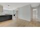 Modern kitchen features white and dark wood cabinets, quartz countertops, and stainless steel appliances at 106 Manganese St, Henderson, NV 89015