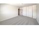 Spacious bedroom with grey carpet and a view of the hallway at 2512 Capistrano Ave, Las Vegas, NV 89121