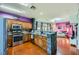 Modern kitchen with stainless steel appliances and a breakfast bar at 2613 Rainbow Cactus Ct, Las Vegas, NV 89106