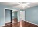 Bedroom with mirrored closet doors and wood flooring at 2728 Lotus Hill Dr, Las Vegas, NV 89134