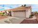 Single story home with attached garage and desert landscaping at 2728 Lotus Hill Dr, Las Vegas, NV 89134