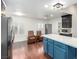 Open concept kitchen with island seating and dark cabinetry at 2728 Lotus Hill Dr, Las Vegas, NV 89134