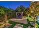 Landscaped backyard with a unique outdoor seating area at 2790 La Bella Ct, Henderson, NV 89052