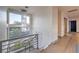 Bright hallway with modern chandelier and hardwood floors at 2790 La Bella Ct, Henderson, NV 89052