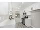 Newly renovated kitchen featuring white shaker cabinets, quartz countertops, and stainless steel appliances at 3115 La Mesa Dr, Henderson, NV 89014