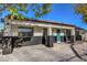 Cute curb appeal with teal front door, black accents, and a well maintained lawn at 428 Rossmoyne Ave, North Las Vegas, NV 89030