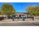 Cute curb appeal with teal front door, black accents, and a well maintained lawn at 428 Rossmoyne Ave, North Las Vegas, NV 89030