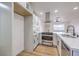 Modern kitchen featuring stainless steel appliances and white cabinetry at 428 Rossmoyne Ave, North Las Vegas, NV 89030