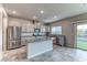 Modern kitchen with stainless steel appliances and island at 4532 Pointleaf St, North Las Vegas, NV 89032