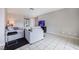 Living room featuring gray couches and tiled floors at 4933 Danbrook Ct, Las Vegas, NV 89110