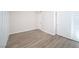 Bright bedroom with wood-look floors and ample closet space at 5260 River Glen Dr # 261, Las Vegas, NV 89103