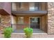 Private patio with metal railing and small landscaping at 5260 River Glen Dr # 261, Las Vegas, NV 89103