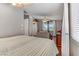 Main bedroom with sitting area and large windows at 7649 Velvet Mist St, Las Vegas, NV 89131