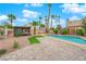 Relaxing backyard oasis with a kidney-shaped pool and patio at 8324 Shark Tank Ct, Las Vegas, NV 89128