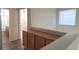 Hallway with wooden cabinets and a partial view of a bathroom at 8695 Canfield Canyon Ave, Las Vegas, NV 89178