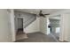 Living area with hardwood floors, a ceiling fan, and an open view to the kitchen at 8695 Canfield Canyon Ave, Las Vegas, NV 89178