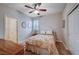 Bedroom with floral bedding and ceiling fan at 897 Las Palomas Dr, Las Vegas, NV 89138