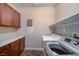 Bright laundry room with cabinets and shelving at 897 Las Palomas Dr, Las Vegas, NV 89138