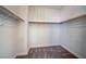 Spacious walk-in closet with ample shelving and neutral carpeting at 897 Las Palomas Dr, Las Vegas, NV 89138