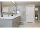 Bright bathroom with double sinks and ample counter space at 909 Riverlawn Pl, Las Vegas, NV 89138