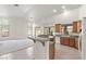 Kitchen with granite counters, wood cabinets and breakfast bar at 916 Temple View Dr, Las Vegas, NV 89110