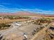 Aerial view showing expansive property with a large riding arena and surrounding landscape at 9350 Homestead Rd, Las Vegas, NV 89143