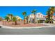 Two-story house with palm trees and a landscaped yard at 9675 Flying Eagle Ln, Las Vegas, NV 89123