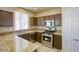 Kitchen with granite countertops and stainless steel appliances at 9675 Flying Eagle Ln, Las Vegas, NV 89123