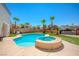 Inviting backyard oasis with a sparkling pool and spa at 9675 Flying Eagle Ln, Las Vegas, NV 89123