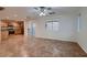 Combined dining and living area with tile floors and ceiling fan at 972 Monte De Oro Ave, Las Vegas, NV 89183