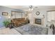 Relaxing living room features a fireplace and large windows at 1111 Healing Waters Ln, North Las Vegas, NV 89031