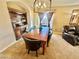 Elegant dining room with a built-in hutch and hardwood table at 2710 Mustang Pass St, Laughlin, NV 89029