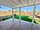 Covered patio with artificial turf and a view of the backyard at 2710 Mustang Pass St, Laughlin, NV 89029