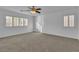 Well-lit bedroom with plantation shutters and ceiling fan at 3227 Monaco Shores Dr, Las Vegas, NV 89117