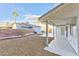 Backyard patio with gravel landscaping and partial view of a neighboring house at 3875 Redwood St, Las Vegas, NV 89103