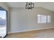 Bright dining room with light walls, wood floors, and modern chandelier at 459 Ash St, Henderson, NV 89015