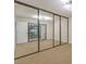 Bedroom featuring mirrored closet doors and neutral walls at 4623 Madreperla St, Las Vegas, NV 89121