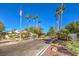 Attractive community entrance with palm trees and flagpole at 4623 Madreperla St, Las Vegas, NV 89121