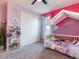 bedroom with a canopy bed and built-in shelving at 4646 Roger River Ave, Las Vegas, NV 89141