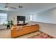 Relaxing living room with a comfortable sectional and ceiling fan at 5141 Steep Cliffs Ave, Las Vegas, NV 89115