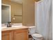 Clean bathroom with wood vanity, shower, and toilet at 5217 Yellow Dawn Ct, Las Vegas, NV 89130