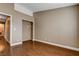 Bedroom with wood-look floors, neutral walls, and closet at 5217 Yellow Dawn Ct, Las Vegas, NV 89130