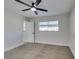 Bedroom with gray carpet, white walls, a ceiling fan, and a window at 5821 Harmony Ave, Las Vegas, NV 89107