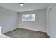 Spacious bedroom featuring grey carpet and a window at 5821 Harmony Ave, Las Vegas, NV 89107