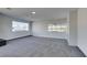 Living area with new carpeting, ample natural light, and a black stone fireplace at 5821 Harmony Ave, Las Vegas, NV 89107