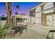 Relaxing patio with covered seating and outdoor dining area at 62 Incline Village Ct, Henderson, NV 89074