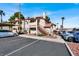 Exterior view of the building with parking lot, stairs, and landscaping at 733 Rock Springs Dr # 201, Las Vegas, NV 89128