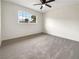 Spacious bedroom with neutral walls and carpet flooring at 7704 Macaw Ln, Las Vegas, NV 89145