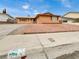 House exterior with a long driveway at 7704 Macaw Ln, Las Vegas, NV 89145