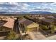 Aerial view showcasing the home's curb appeal and mountain backdrop at 860 Bobcat Run, Mesquite, NV 89034